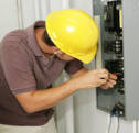 Electrician Repairing Electrical Breaker Panel